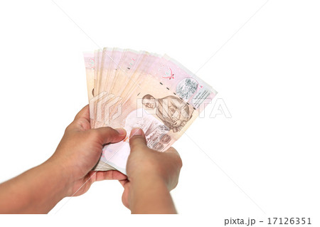 Close up hands holding Thai money isolated on white 17126351