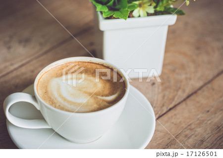 White coffee cup on the table at morning time White coffee cup on the table at morning time 17126501