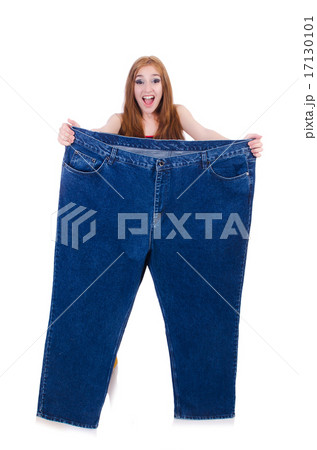 Woman in dieting concept with big jeans Woman in dieting concept with big jeans 17130101