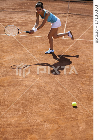 Girl playing tennis on the court Girl playing tennis on the court 17130303