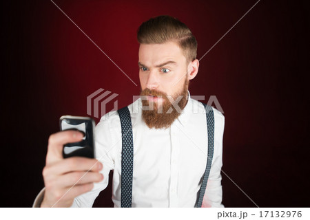 Young man with beard making selfie Young man with beard making selfie 17132976
