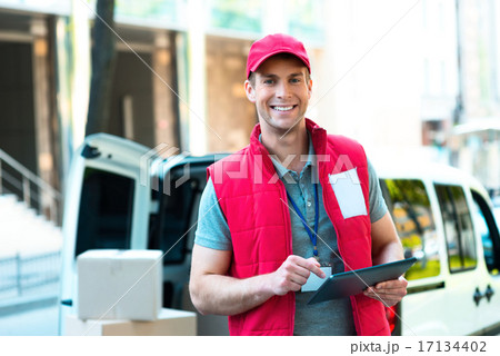 Courier Delivering Package By Van 17134402