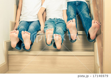 Portrait of happy children which are sitting on the stairs in th Portrait of happy children which are sitting on the stairs in th 17146979