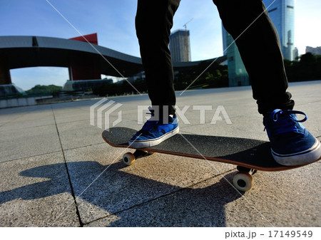 skateboarder legs skateboarding at sunrise city 17149549