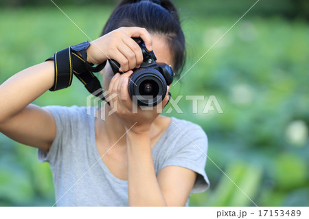 young woman photographer taking photo outdoor young woman photographer taking photo outdoor 17153489