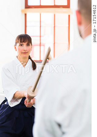 Man and woman having Aikido sword fight 17154612