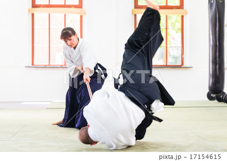 Man and woman having Aikido stick fight 17154615