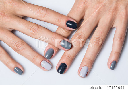 Hand with a stylish gray manicure isolated on white background 17155041