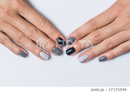Hand with a stylish gray manicure isolated on white background 17155046