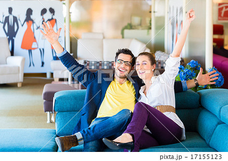 Couple buying couch in furniture store 17155123