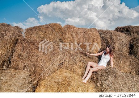 Young pretty woman relaxes on hay 17158844