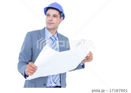 Businessman looking at a blueprint 17167001