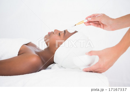 Pretty woman getting a facial treatment Pretty woman getting a facial treatment 17167337