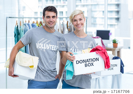 Volunteer couple holding donation boxes Volunteer couple holding donation boxes 17167706