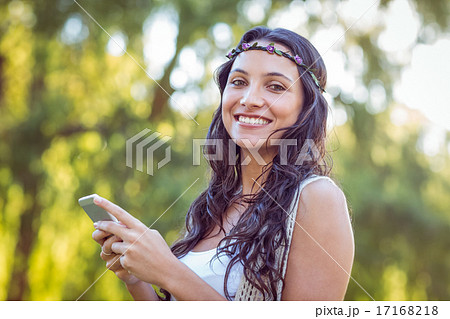 Pretty hipster using her smartphone 17168218