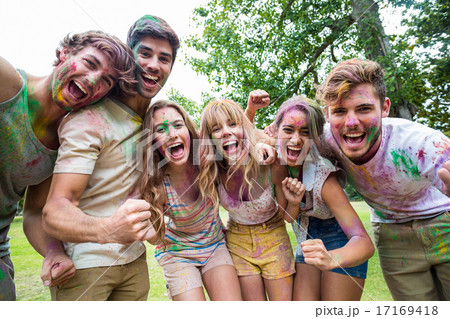 Happy friends throwing powder paint Happy friends throwing powder paint 17169418