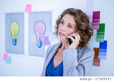 Creative businesswoman having phone call 17169433