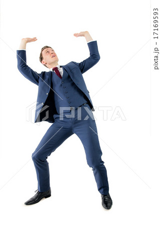 A surprised businessman holding something A surprised businessman holding something 17169593