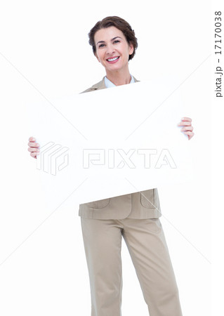 Smiling businesswoman holding blank sign 17170038