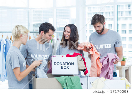 Volunteers separating donation stuffs 17170093