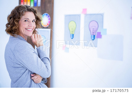 Creative businesswoman looking at camera Creative businesswoman looking at camera 17170575