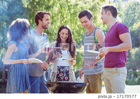 Happy friends in the park having barbecue 17170577