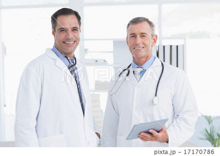 Doctor and his colleague looking at camera 17170786