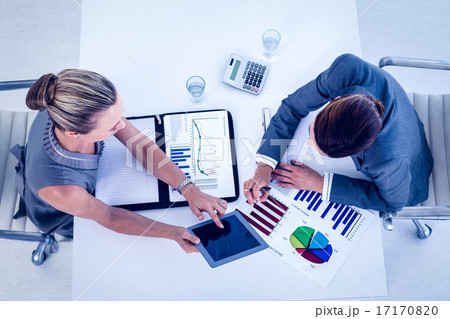 Businesswomen working together at desk Businesswomen working together at desk 17170820