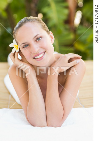 Peaceful blonde lying on towel 17170912