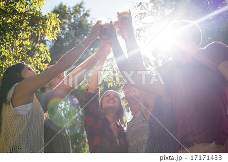 Happy friends in the park having beers 17171433