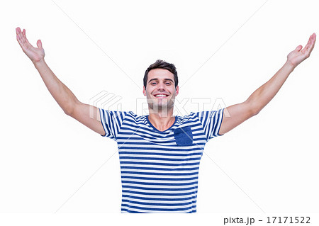 Handsome hipster smiling at camera with arms outstretched Handsome hipster smiling at camera with arms outstretched 17171522
