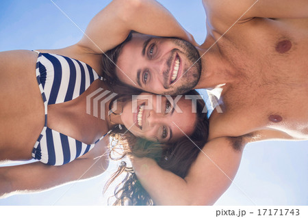 Smiling couple looking at camera Smiling couple looking at camera 17171743