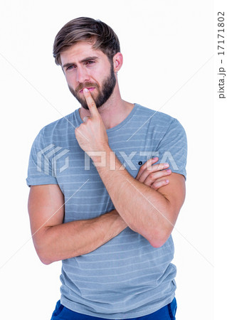 Handsome man thinking with finger on lips Handsome man thinking with finger on lips 17171802