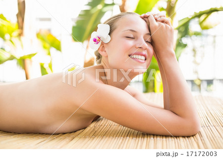 Attractive woman getting massage on her back Attractive woman getting massage on her back 17172003