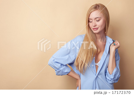 Attractive young woman is seducing in male clothing 17172370