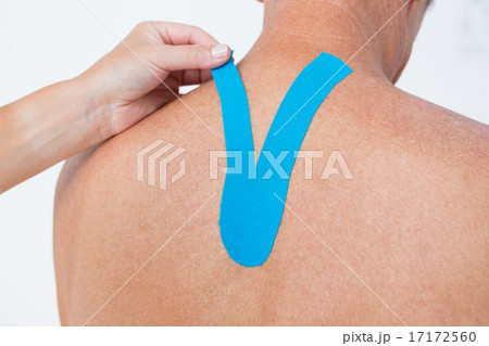 Doctor examining her patient back 17172560