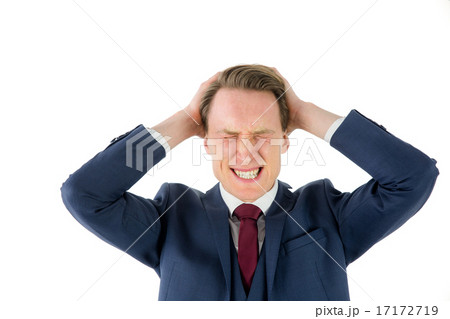 Nervous businessman looking at camera with hand on head 17172719