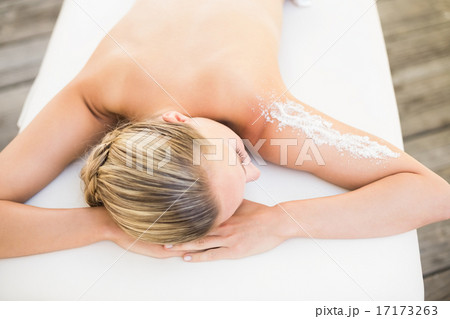 Beautiful woman lying on massage table Beautiful woman lying on massage table 17173263
