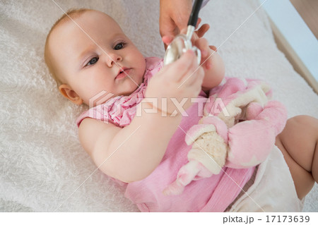 Beautiful cute baby girl with doctor with stethoscope 17173639