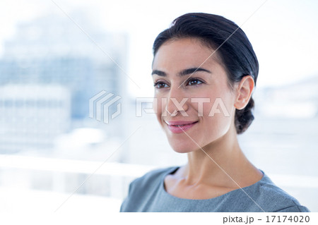 Thoughtful businesswoman looking away Thoughtful businesswoman looking away 17174020