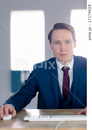 Serious businessman looking at camera Serious businessman looking at camera 17174028