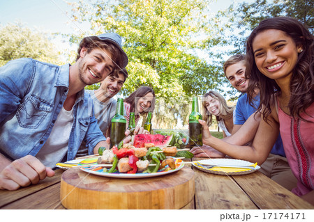 Happy friends in the park having picnic 17174171
