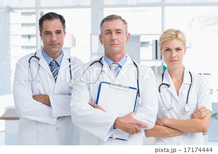 Concentrated doctors looking at camera 17174444
