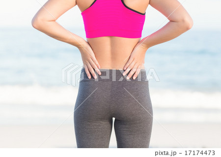 Wear view of fit woman looking at the sea Wear view of fit woman looking at the sea 17174473