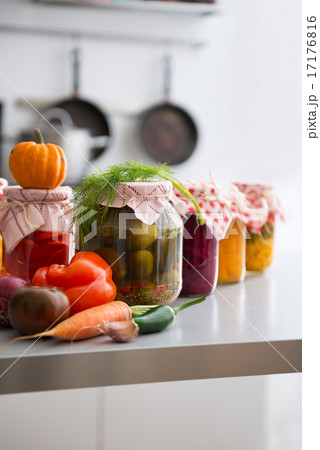 Closeup on jars of pickled vegetables on table 17176816