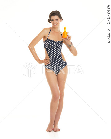 Full length portrait of happy young woman in swimsuit showing bo 17178486