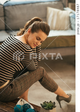 Young woman sitting in loft apartment 17178487