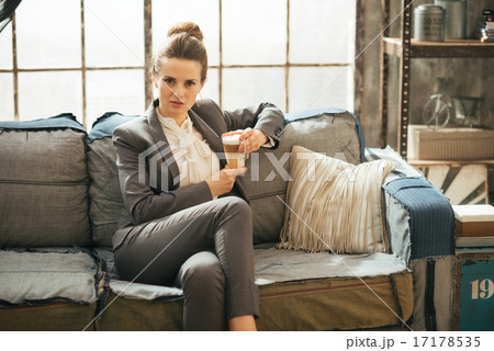 Business woman with coffee latte in loft apartment 17178535
