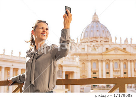 Young woman making selfie on piazza san pietro in vatican city s 17179088