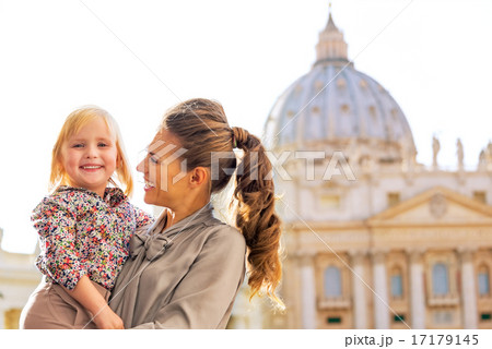 Portrait of happy mother and baby girl in front of basilica di s 17179145